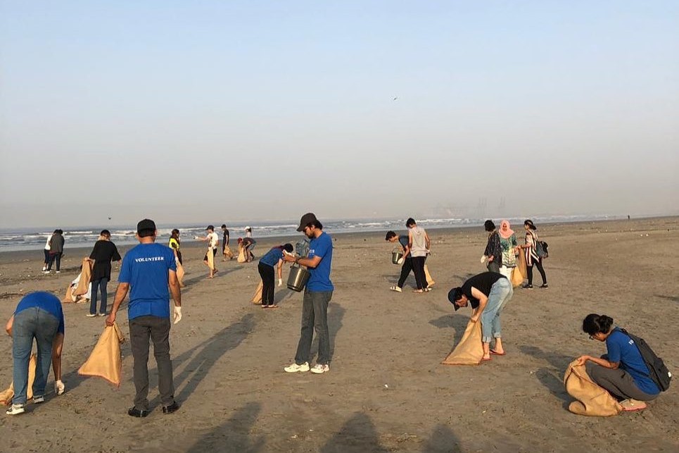 Nielsen volunteers clean a beach