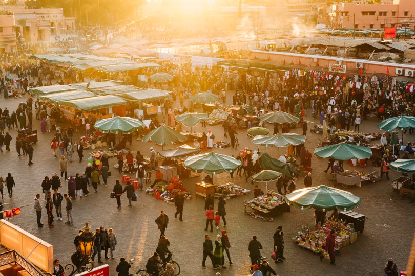 Sunlit scene of crowded marketplace